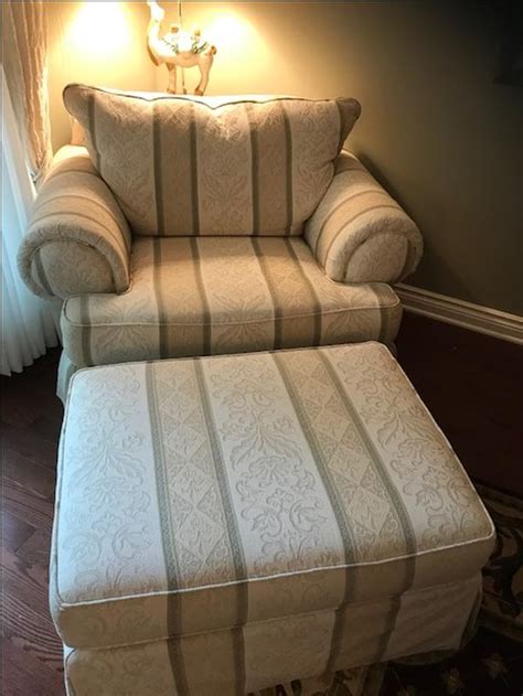 Chair features a high back with arm rests. Oversize Chair and matching Ottoman