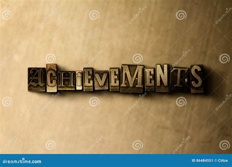 Achievements Close Up Of Grungy Vintage Typeset Word On Metal