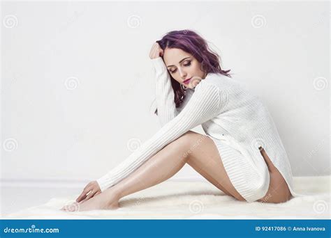 Girl With Purple Hair And Tattoos On His Body Posing In White Shirt On