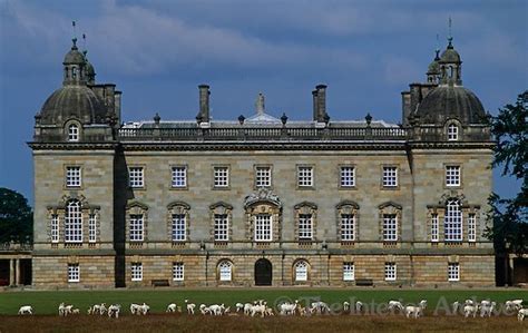 The East Front Of Houghton Hall With A Herd Of White Deer Grazing In