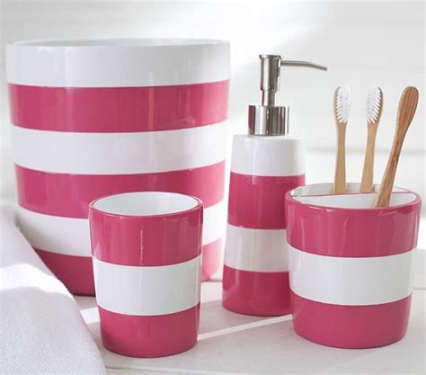 Pink And White Striped Bathroom Accessories On A Counter With