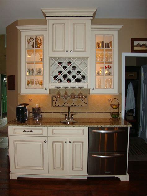 Some builders will use nails to attach lower cabinets. Cute built in wine rack and glass light up cabinets, but I ...