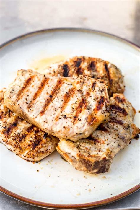 Pork chops are given a smoky, spicy rub, then grilled to tenderness for a main dish in under 1 hour. Grilled Pork Chops (How to Grill Juicy Pork Chops ...