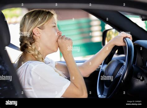 A Female Driver Is Yawning Stock Photo Alamy