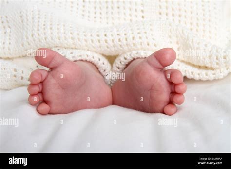 Close Up Of Newborn Baby Boy Feet With The Heel Together And Toes