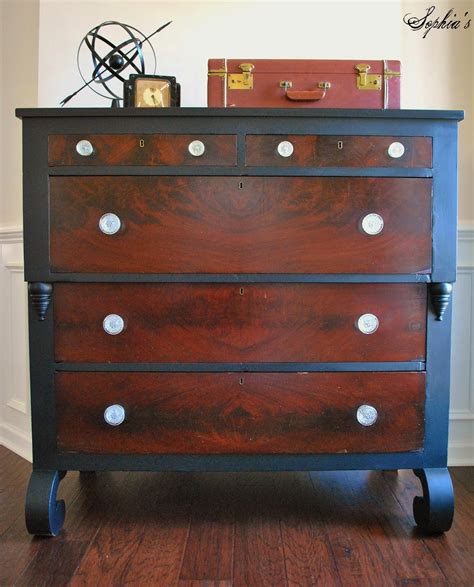 It's made from a blend of solid and engineered wood with mahogany veneers. Sophia's: Black Empire Dresser