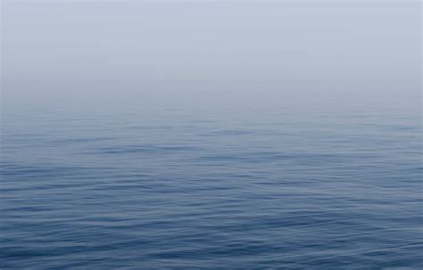 Calm Blue Sea Covered In A Soft Mist Soft Sea Mist 4k Hd Wallpaper