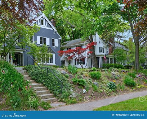 Tree Lined Neighborhood of Middle Class Suburban Houses Stock Photo