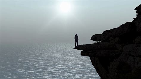 The Silhouette Of Man Standing On Cliff Edge Stock Footage Sbv