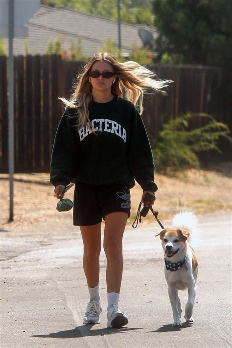 Olivia Holt Wears A Casual Sweatshirt And Shorts While Out Walking Her