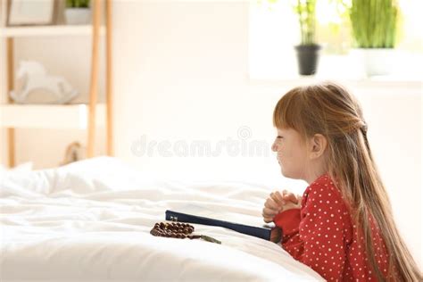 Little Girl With Bible Praying In Bedroom Stock Image Image Of