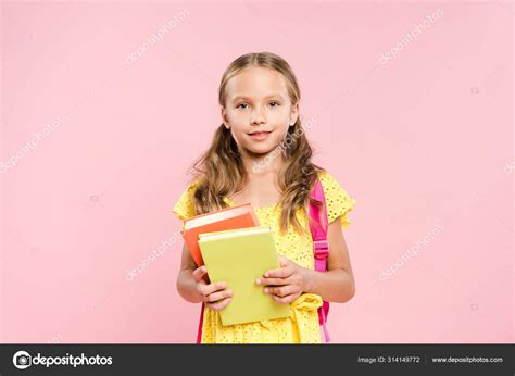 Smiling Schoolgirl Backpack Holding Books Isolated Pink — Stock Photo