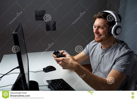 Man In Headset Playing Computer Video Game At Home Stock Photo Image