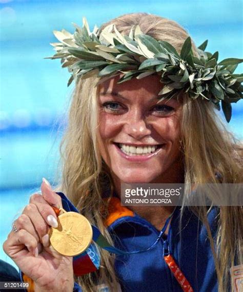 Inge De Bruijn From Netherlands Poses On The Podium After Winning The