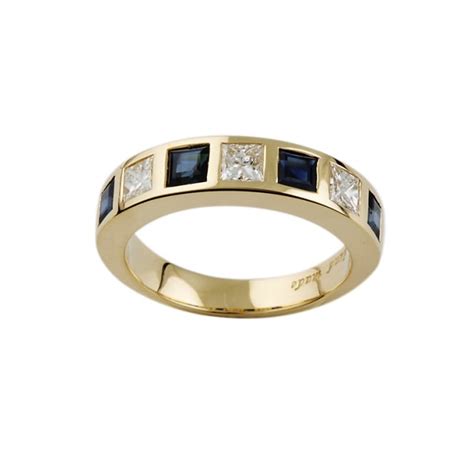 Womens 9ct gold diamond cluster oval sapphire ring for sale direct from the manufacturers newburys making stunning diamond rings from the uk. 9ct Yellow Gold Blue Sapphire and Diamond Half Eternity ...