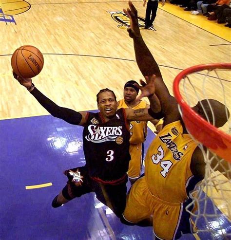 Iverson Leaps To The Basket Around Shaquille O Neal During Game 1 Of