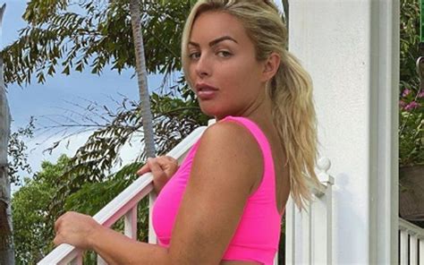 mandy rose flexes her side profile in new pink swimsuit photo pink swimsuit swimsuits side