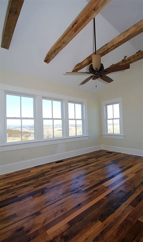 Reclaimed Wood Floors In Master Bedroom With Vaulted Ceiling And