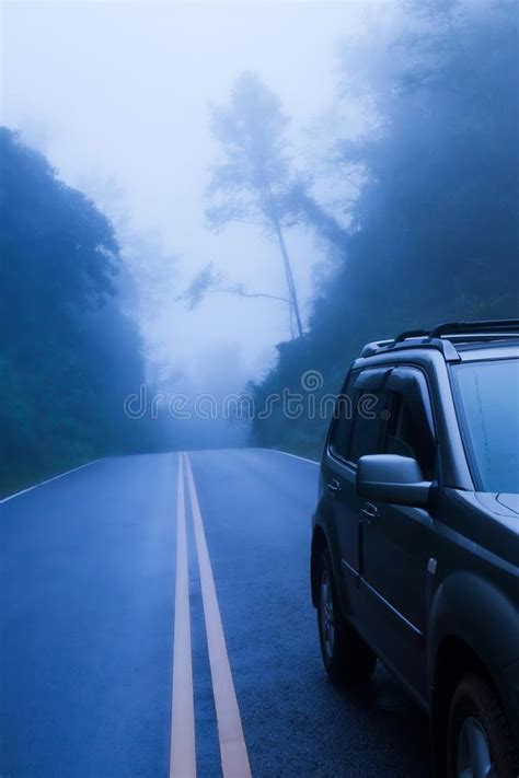 Suv Car On A Mountain Road In The Mist Stock Photo Image Of Line