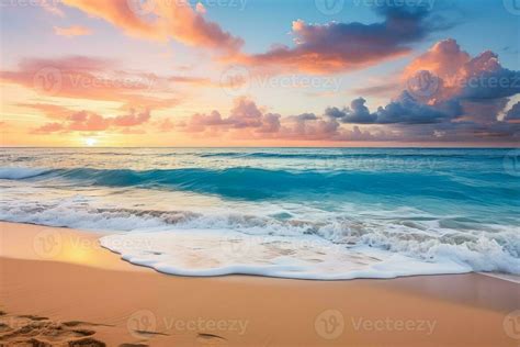 Sandy Beach Blue Clouds Gentle Ocean Waves And Warm Sunset Light Create A Serene Atmosphere