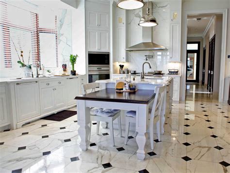 This rugged stone floor is a great compliment to the stainless steel kitchen. What You Should Know About Marble Flooring | DIY