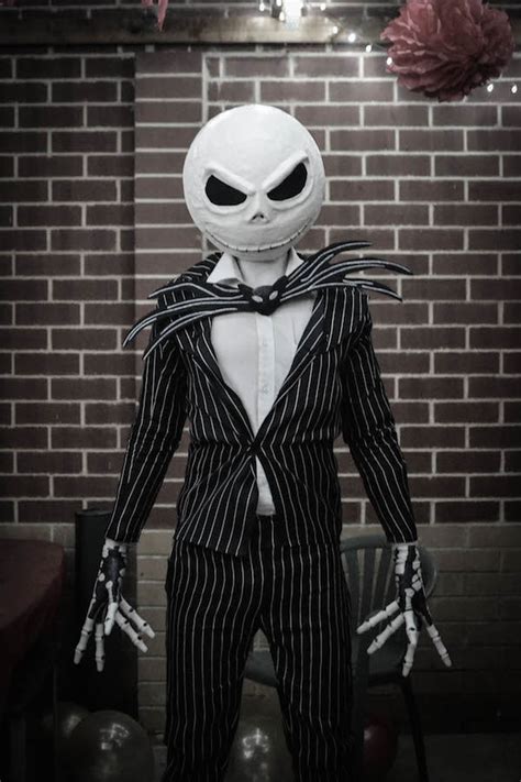 Features a blue striped interior lining a la tim burton style with an inner pocket and a zippered pocket. Jack Skellington Costume | Costume Pop | Costume Pop
