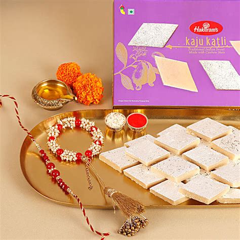 Buy Send Sneh Red White Bhaiya Bhabhi Rakhi Set Haldiram Kaju Katli