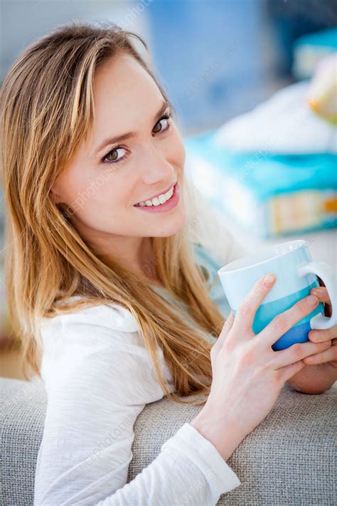 woman drinking hot beverage stock image c033 1588 science photo library