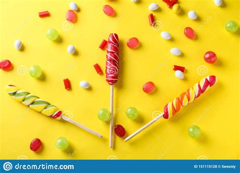Delicious Candies With Lollipops On Color Background Stock Photo