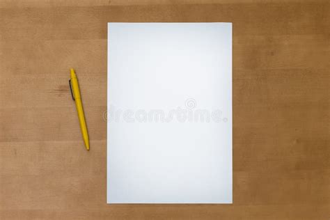 Pen And Blank Paper Sheet On A Wooden Table Stock Photo Image Of