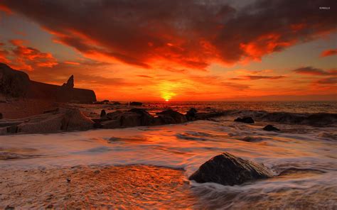 Red Sunset Above The Rocky Beach Wallpaper Beach