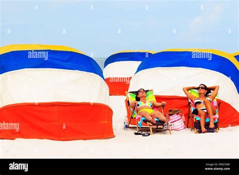 Two Women Sunbathe On Beach Hi Res Stock Photography And Images Alamy