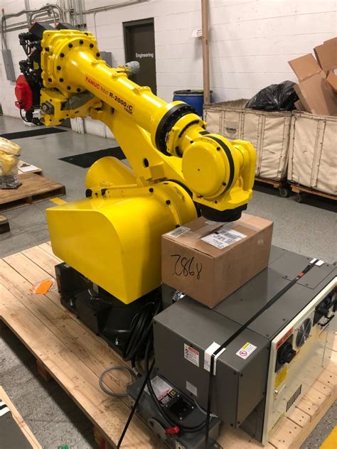 Fanuc robodrill with integrated fanuc robot and haeberle table. Refurbished Fanuc R-2000iC: 6 Axis Industrial Robot for Sale