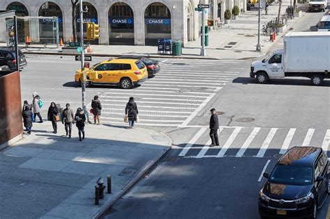 People Walking Across A Street In New York Editorial Stock Photo