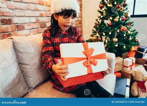 Cheerful Kid Excited Looking At Xmas Present Stock Photo Image Of
