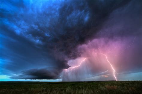 A Beautiful Stormy Sky With Lightning Above The Field Wallpapers And