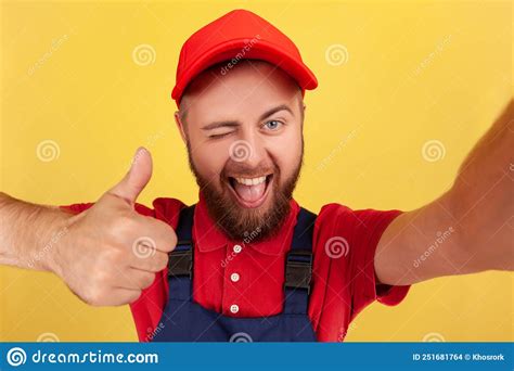 Smiling Worker Man Wearing Blue Uniform Taking Selfie Looking At Camera