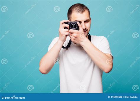 Picture Of Handsome Emotional Young Man Photographer Holding Camera