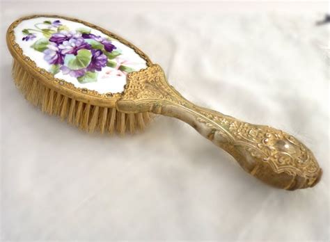 Art deco country style water fall low boy vanity with round mirror. Antique hair brush hand painted porcelain top ormolu ...