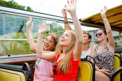 Group Of Smiling Friends Traveling By Tour Bus — Stock Photo © Syda