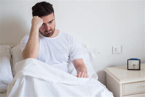 Sad And Upset Man Waking Up In The Morning Stock Image Image Of