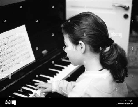 Girl Playing Piano Side View Bandw Stock Photo Alamy