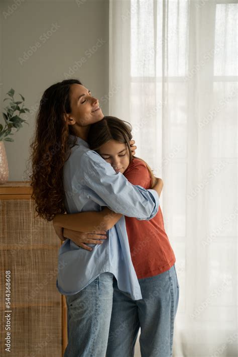 Young Loving Mother Hugging Her Teenage Daughter Mom Demonstrating