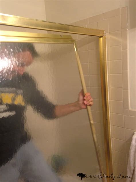 Open the door, and ask your helper to slightly lift the screen door. How to Remove Sliding Shower Doors | Life on Shady Lane