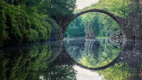 Arched Devils Bridge Rakotzbrucke In Summer Kromlau Germany