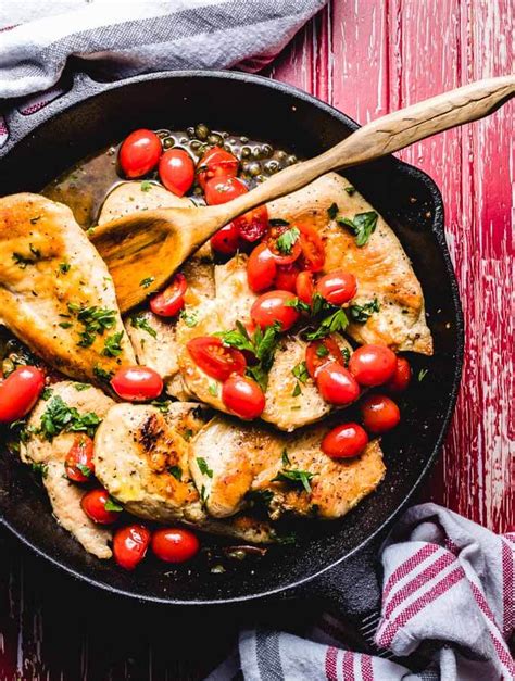 Add the chicken back into the pan, and spoon the pan juices and tomato/garlic mixture all over the chicken! This Italian Chicken with a caper cherry tomato sauce has ...