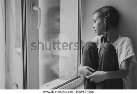 Sad Little Girl Sitting Near Window Stock Photo 1009634566 Shutterstock