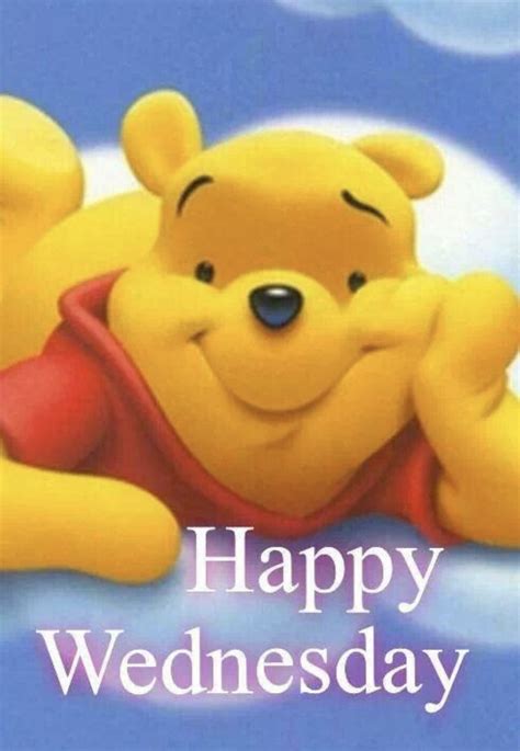 A Cartoon Winnie The Pooh Laying On Top Of A Cloud With His Arms Crossed