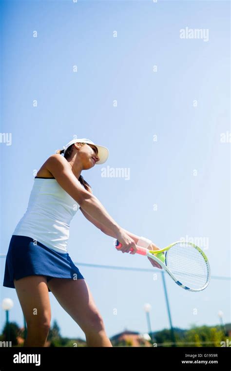 Beautiful Female Tennis Player Serving Outdoor Stock Photo Alamy