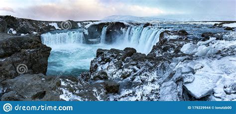 Godafoss Waterfall At Sunset In A Snowstorm Northern Iceland Europe